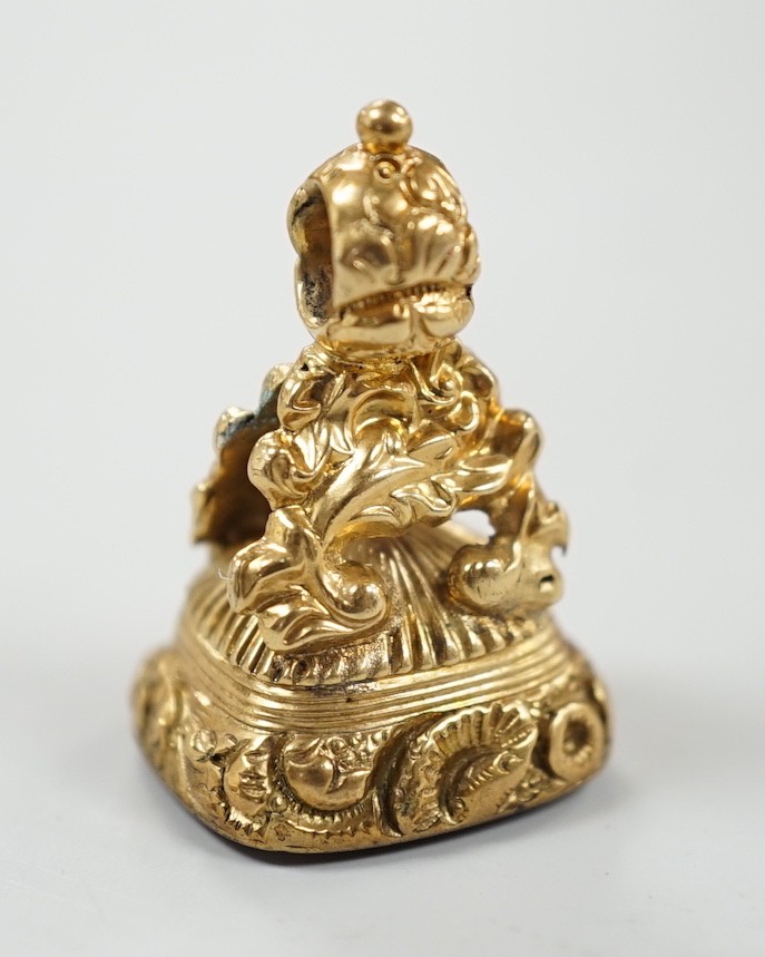 A 19th century yellow metal overlaid and amethyst set fob seal, the matrix carved with flowers and motto, 27mm.